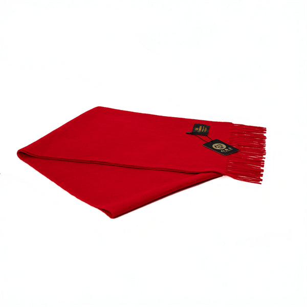 Close-up of Ruby Echo lambswool scarf highlighting vibrant red fabric, soft finish, fine fringe detailing, and branded tag for a premium luxury feel
