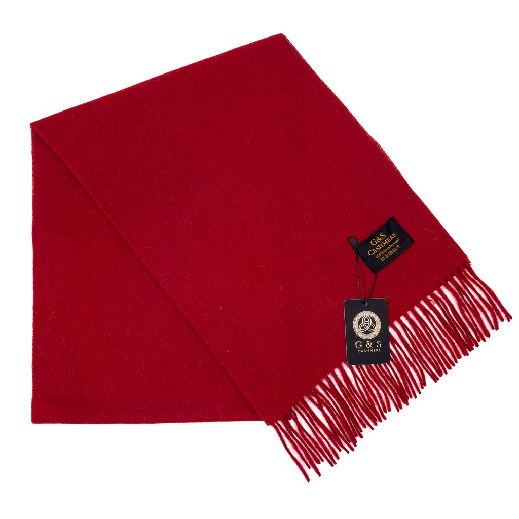 Cardinal Vale lambswool scarf in solid deep red, featuring a smooth soft finish, fine fringe edges, and subtle branding tag, displayed folded on a white background